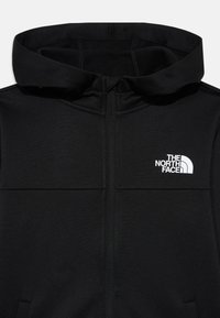 Black zip-up hoodie made from a smooth, stretchy fabric. Features a front zipper, a relaxed hood, and a white logo on the left chest.
