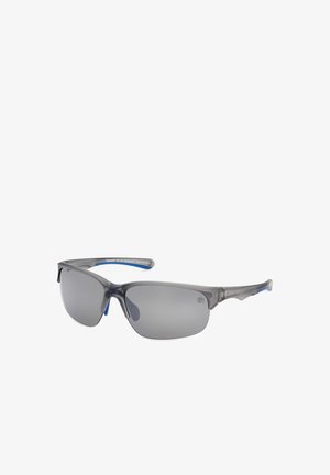 Gafas de sol deportivas semirimless grises con lentes tintadas y patillas curvas, con sutiles detalles azules en los brazos interiores.