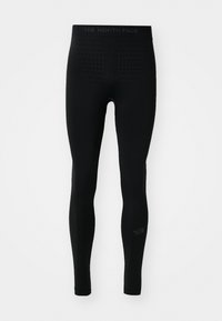 Leggings noirs avec une taille haute, présentant un motif texturé à l'arrière, et le logo "The North Face" sur la jambe inférieure.