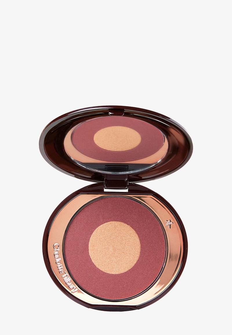Round blush compact with a bronze casing. Features a maroon blush and a golden highlight in circular shapes. Smooth texture, glossy finish.