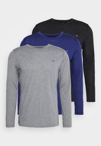 Three long-sleeve shirts: gray, blue, and black. Fabric appears smooth; solid colors with a small logo on the chest. Round necklines.