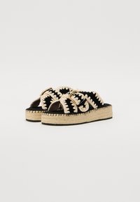 Sandali espadrilles neri con spesse cinghie in tessuto intrecciato, una suola intermedia in juta intrecciata e una soletta in tessuto nero texturizzato.
