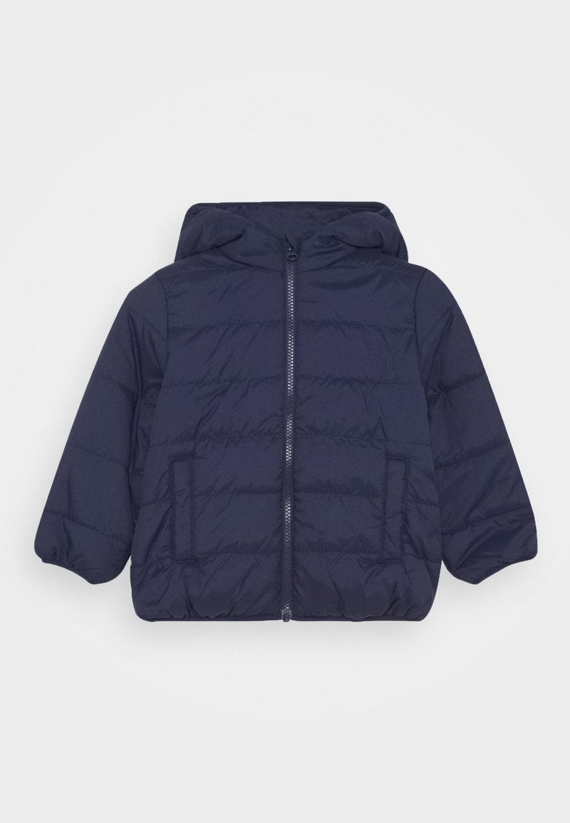 Veste matelassée bleu marine à capuche avec fermeture éclair à l'avant, poignets élastiques et deux poches avant. Présente une texture matelassée et une coupe décontractée.