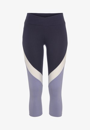 Navy and light purple leggings with a wide waistband, featuring a wavy color-block pattern in cream and violet. Made from stretchy fabric.