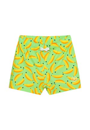 Shorts de bain verts avec un motif intégral de bananes jaunes et une fermeture à cordon blanc à la ceinture élastique.