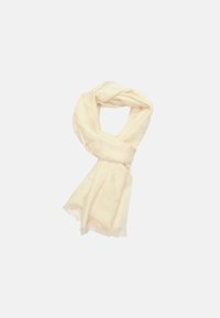 Sciarpa color crema realizzata in un tessuto morbido, caratterizzata da un motivo sottile, rifinita con delicate frange alle estremità.