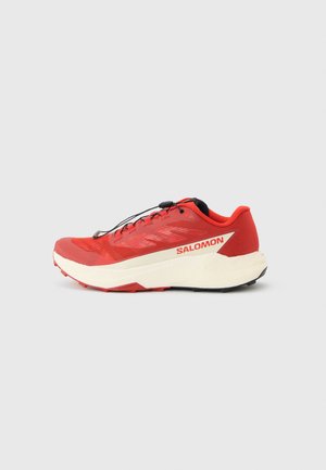 Red trail running shoe with white midsole, black outsole, quick-lace system, and "SALOMON" logo on the side.