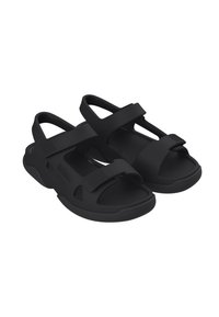 Sandali neri in materiale gommoso, caratterizzati da un design aperto, cinturini regolabili, soletta testurizzata e suola con una presa pronunciata.