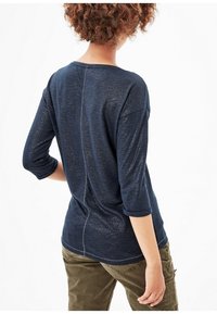 Navy blue, lightweight, textured top with three-quarter sleeves, round neckline, and a center seam detail on the back.