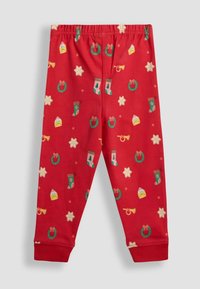 Pantaloni de pijama roșii din bumbac cu modele festive de coroane, ciorăpe și stele, și cadouri. Talie elastică, manșete ajustate la glezne.
