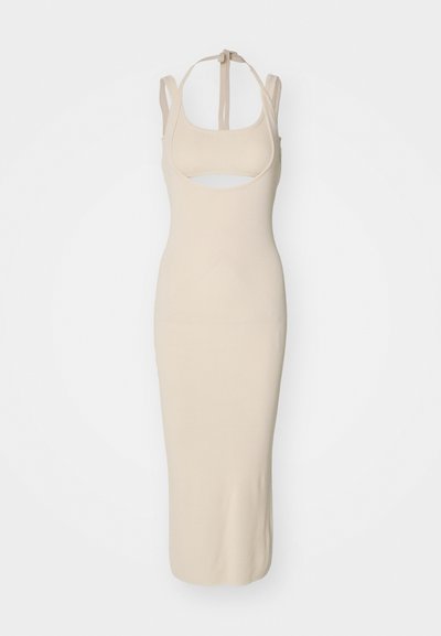 Beige knit midi dress with a fitted silhouette, square neckline, cutout detail, and adjustable straps. Smooth texture with a solid pattern.