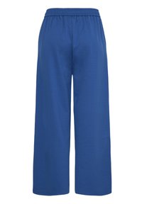 Pantalon à jambes larges en tissu de coton bleu, avec une ceinture élastique et une texture lisse. Le design est simple, sans détails supplémentaires.
