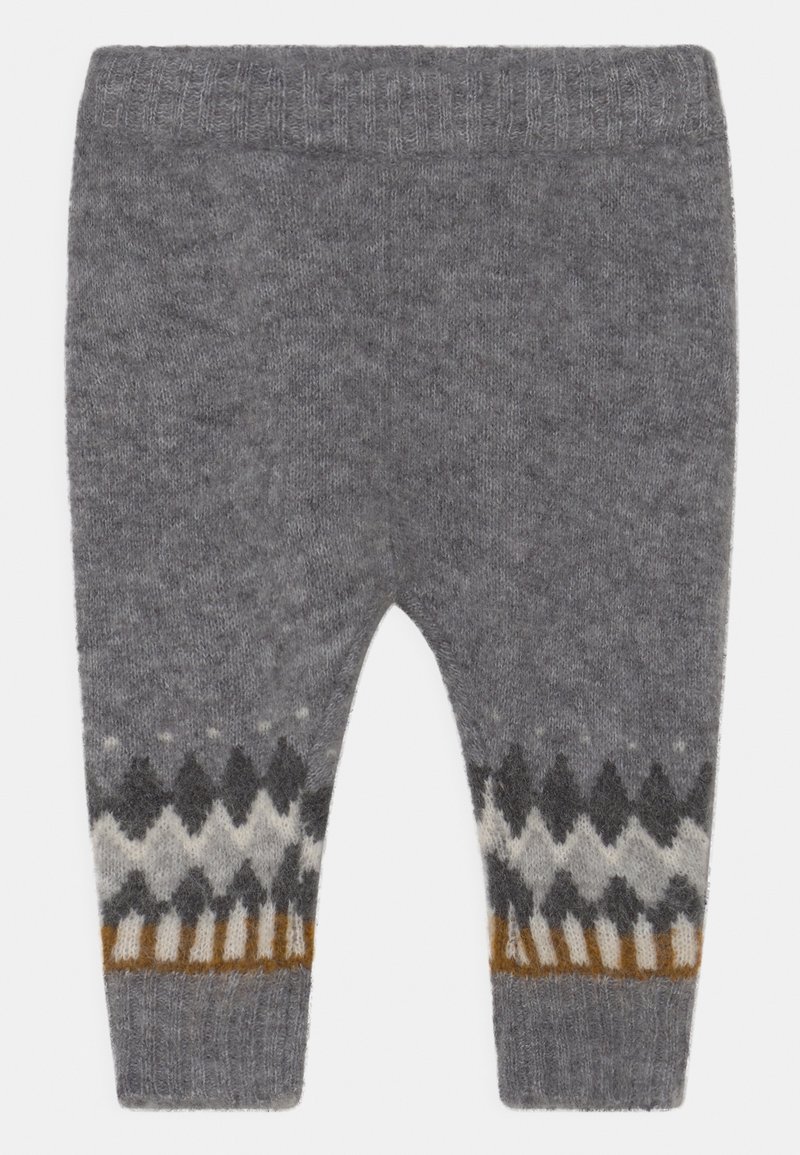 Pantalon gris en tricot avec une ceinture côtelée et une partie basse à motifs géométriques en noir, blanc et accents orange.