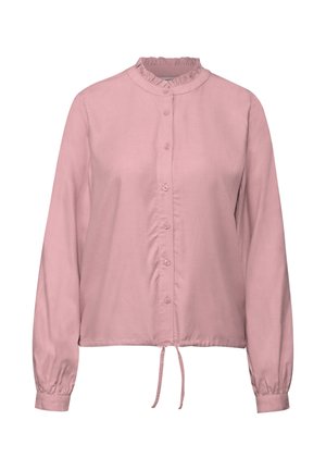 Halenka s dlouhým rukávem v měkké růžové látce s volánkovým límcem, předním zapínáním na knoflíky a zavázáním v pase. Hladká textura a volný střih.