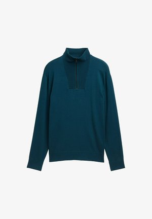 Teal neulepaita, jossa on korkea kaulus, puolivälin vetoketju edessä ja ribbitetty pinta. Pitkät hihat ja rento malli lisäävät mukavuutta.