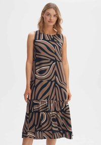 Sleeveless dress in dark navy with a large abstract brown pattern. Features a tiered skirt, smooth texture, and flared hemline.