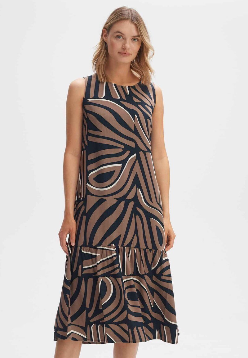 Sleeveless dress in dark navy with a large abstract brown pattern. Features a tiered skirt, smooth texture, and flared hemline.