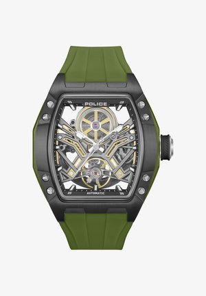 Čierne a zlaté skeletonové hodinky so zeleným gumovým remienkom. Vyzdobené zložitým dizajnom prevodov, odhaleným mechanizmom a striebornými detailmi na puzdre.