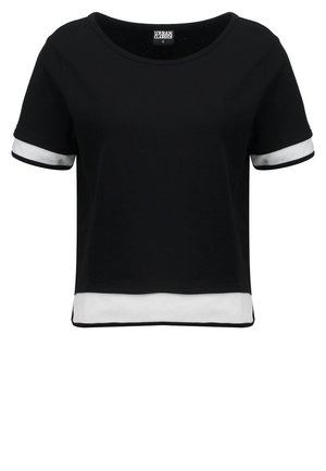 Black cropped T-shirt with short sleeves, featuring white mesh accents at the sleeves and hem. Smooth fabric; rounded neckline.
