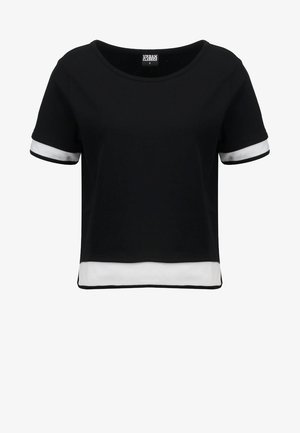 Sort cropped T-shirt med korte ærmer, prydet med hvide mesh-detaljer ved ærmerne og kanten. Glat stof; rund halsudskæring.