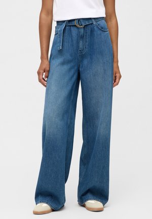 Wide-leg denim trousers in medium blue. High-waisted with a fabric belt and a metal buckle. Soft texture with minimal fading design.