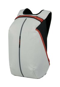 Compact gray backpack with subtle grid pattern, red trim, black sides, and vertical zipper down the center front.