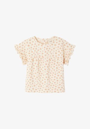 Cream-colored baby shirt with peach heart print, ruffled short sleeves, round neckline, and snap closure at the back.
