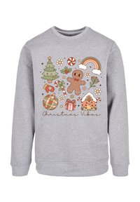 Grauer Pullover mit festlichem Design und weihnachtlichen Illustrationen: Lebkuchenmann, Baum, Geschenke, Zuckerstangen und ein Regenbogen.