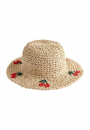 Beige geweven strohoed met brede rand en kleine rode bloemenborduursel op de rand.