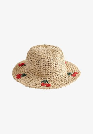 Beige geweven strohoed met brede rand en kleine rode bloemenborduursel op de rand.