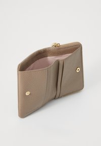 Beige leather wallet with a textured finish, gold hardware, two card slots, and a zip-around closure. Interior lined in light pink fabric.