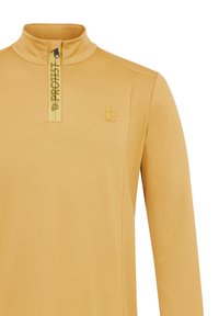 Poloko s dlhým rukávom v svetložltej farbe na polovičný zips. Vyrobené z hladkej tkaniny. Disponuje malým logom a vysokým golierom.