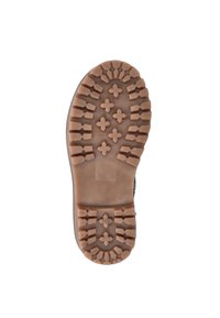 Bruine rubberen buitenzool met diepe loopprofielen, voorzien van kruispatronen en een textuur. Rond afgebroken rand met een gladde binnenafwerking.