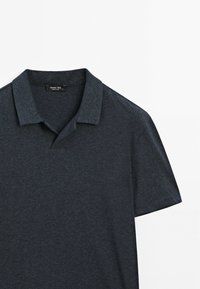 Dark gray short-sleeve polo shirt with a classic collar, displayed flat on a white background.