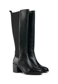 Black knee-high boots with a smooth leather front and elastic fabric at the back, featuring a square heel and pointed toe design.