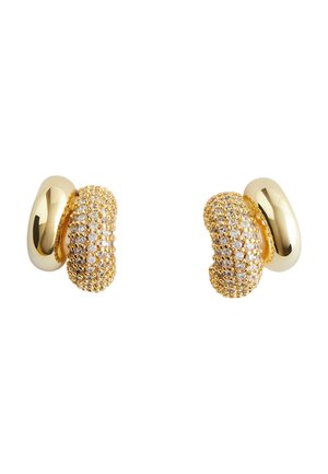 Gold double hoop earrings with one smooth polished half and one half encrusted with small clear crystals.