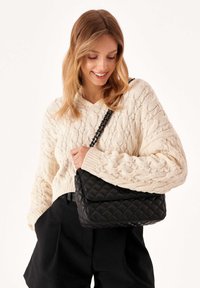 Kazar VIDIA - Cross body bag - black