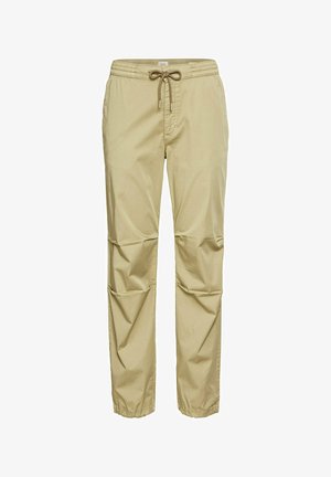 Beige lightweight trousers featuring an elastic waistband with drawstring, side pockets, and a relaxed fit with tapered cuffs.