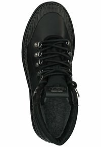 Black hiking shoe with a smooth leather upper, textured rubber rand, metal eyelets, and a padded collar for comfort.