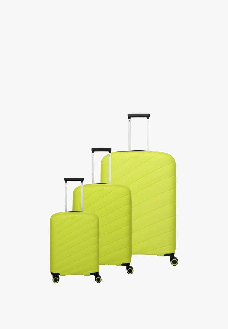 Set di tre valigie rigide di un vivace verde lime. Strisce diagonali testurizzate, manici neri estensibili e basi con quattro ruote.