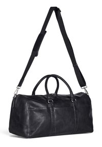 Black leather duffel bag with two top handles and adjustable shoulder strap. Features a zip closure and smooth texture with subtle stitching.