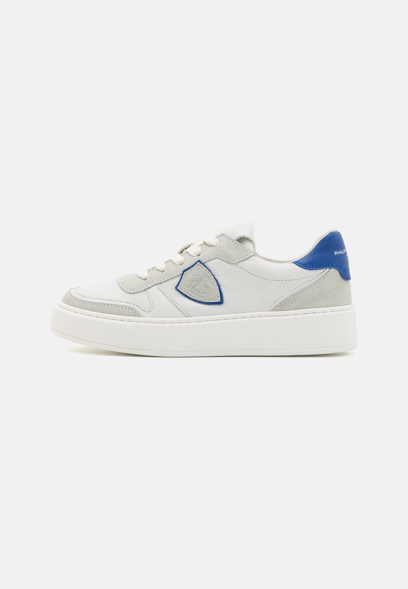 White leather sneakers with blue accents, featuring suede detail, a textured finish, and a raised white rubber sole. Lace-up design.