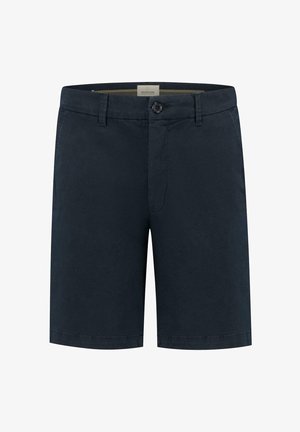 Tummansinisiä puuvillahousuja, joissa on napillinen suljenta, suora leikkaus ja litteä etuosa. Mukana vyölenkit ja minimaalinen muotoilu.