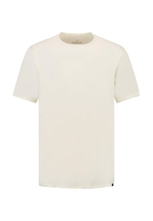 Cream-colored cotton t-shirt with a round neckline and short sleeves. Features a simple, smooth texture with a straight hem and minimal branding.