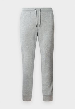 Gray sweatpants made of soft material, featuring a tapered design, adjustable drawstring waistband, and ribbed ankle cuffs.