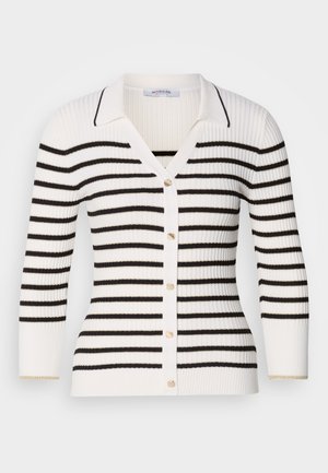 Striped cardigan in white and black. Features a ribbed texture, button closure, V-neck, and short sleeves with subtle gold accents on cuffs.