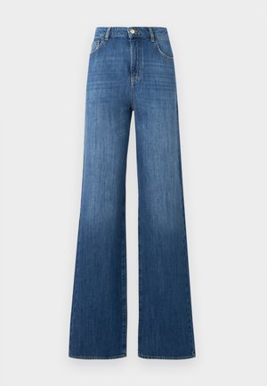 Høyt midje wide-leg jeans i mellomblå denim. Har frontlommer, glidelås med metallknapp, og en ren hemfinnish.