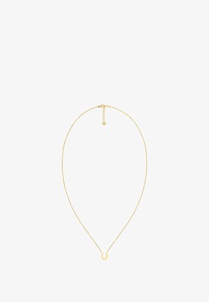 Zelta krāsas kaklarota ar smalku ķēdi un U formas piekariņu. Iekļauj mājputna skavubu un regulējamu garumu ar mazu birku.