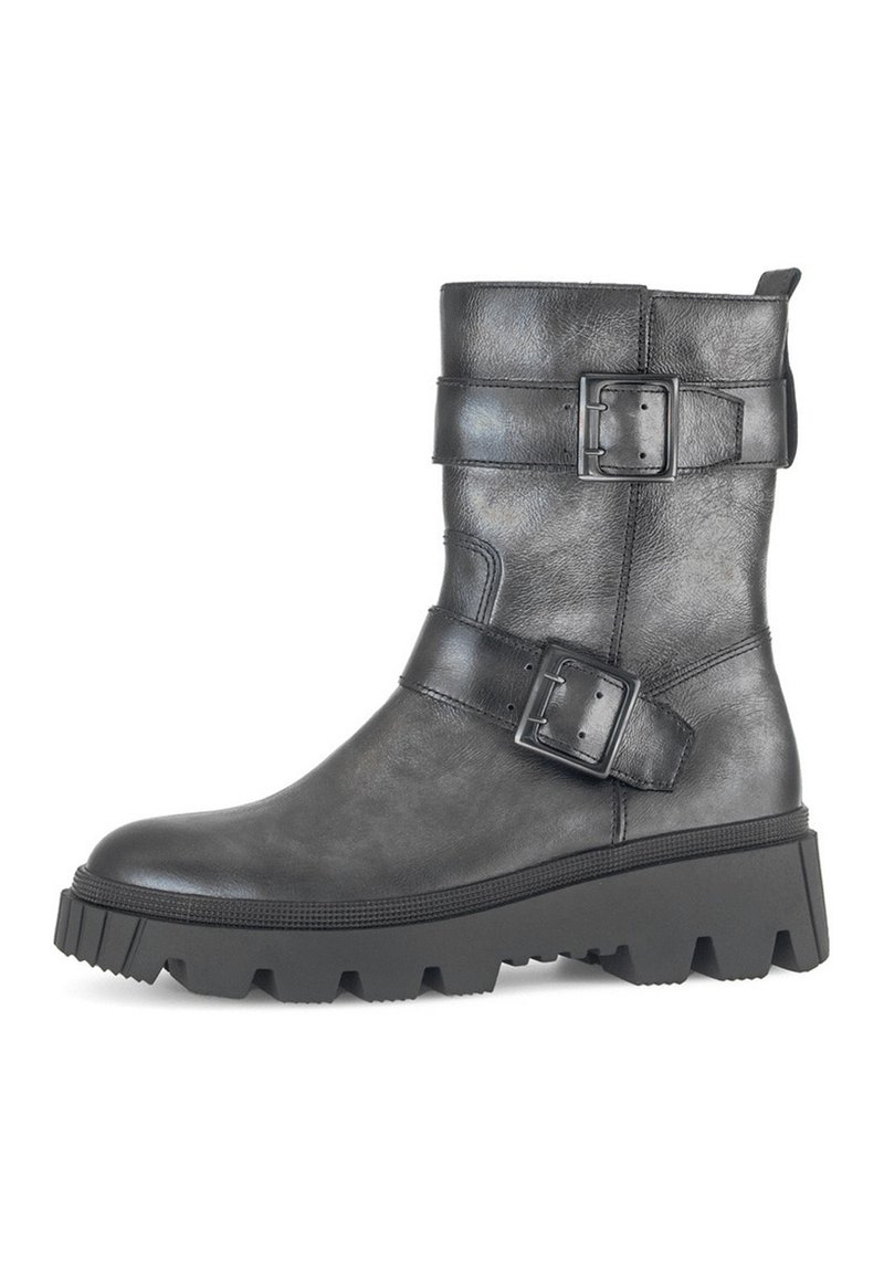 Black leather ankle boot with two prominent buckles, textured surface, chunky rubber sole, and a slightly rounded toe.