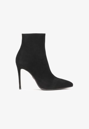 Black suede ankle boot with a pointed toe and stiletto heel. Smooth texture and seamless design, featuring a high shaft for ankle coverage.